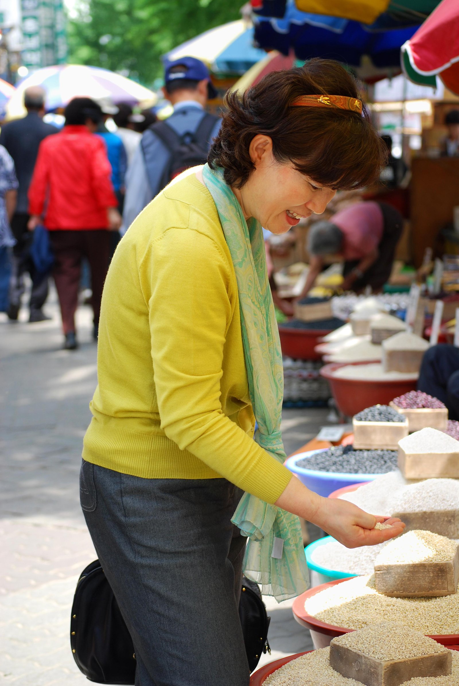 asian-woman-looking-grains-market