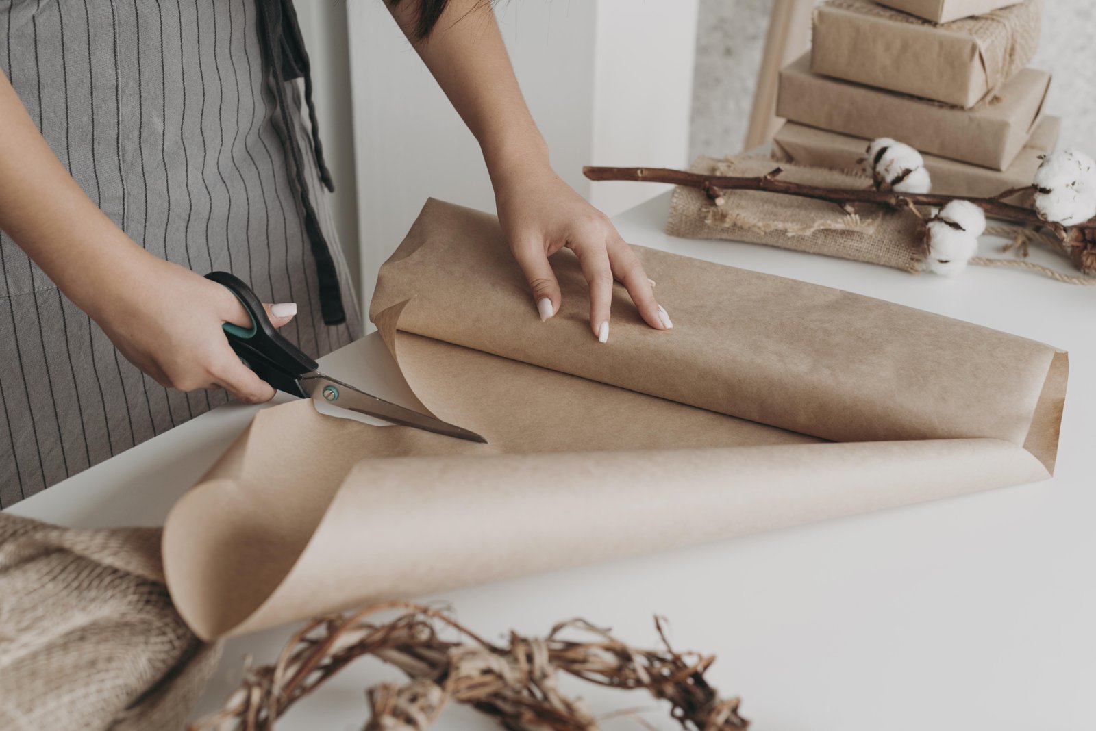 close-up-hands-cutting-paper
