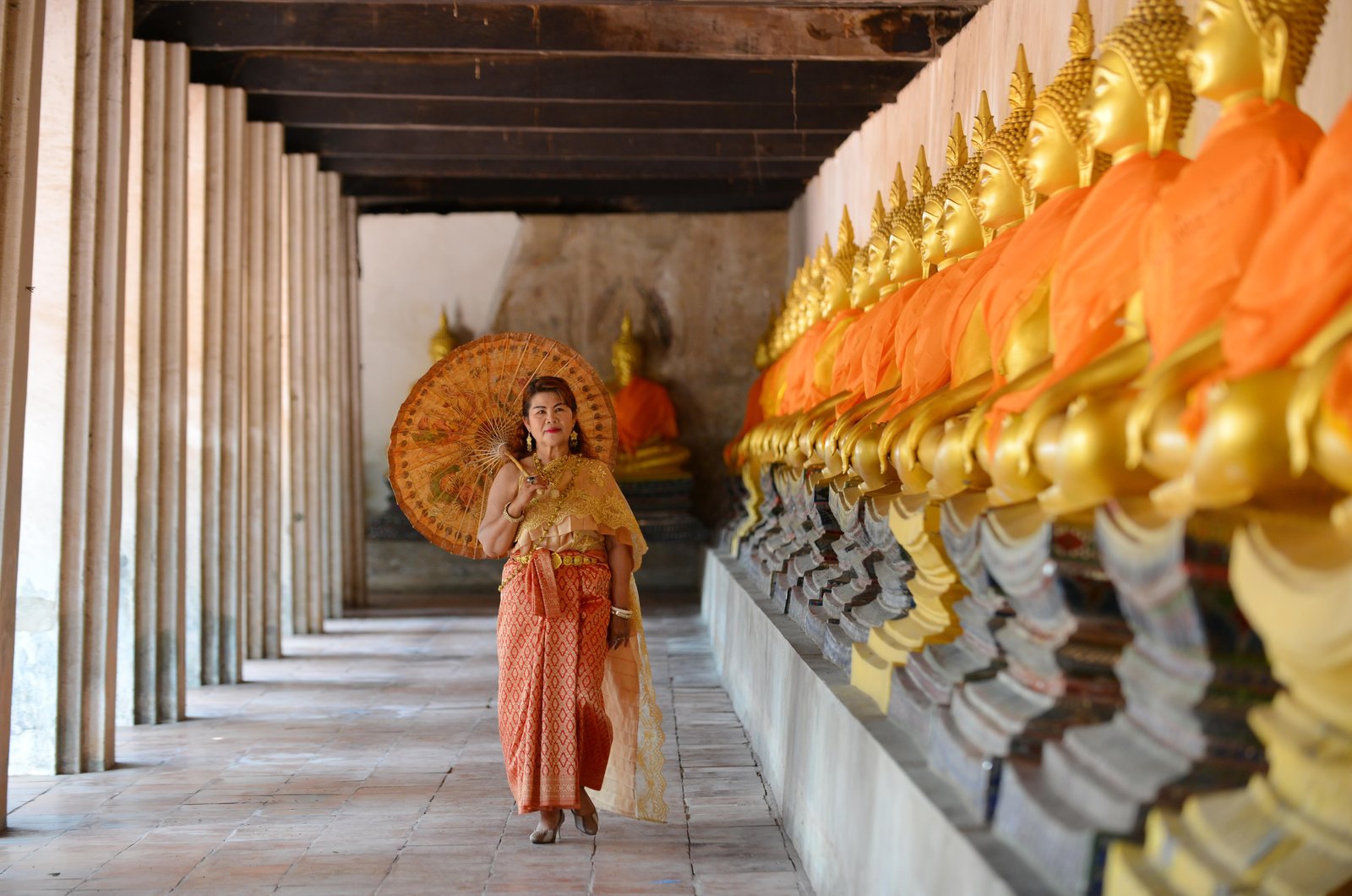 happy-retired-woman-traditional-thai-dress-travel-temple
