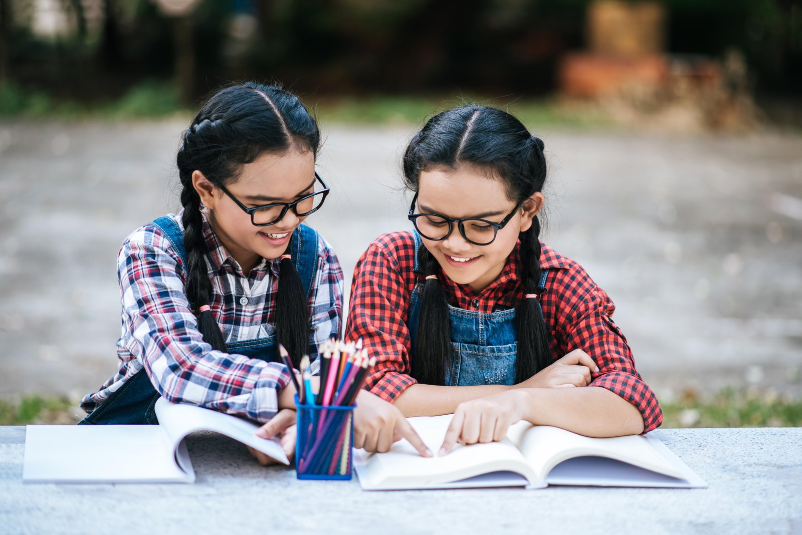 two-students-studying-together-online-with
