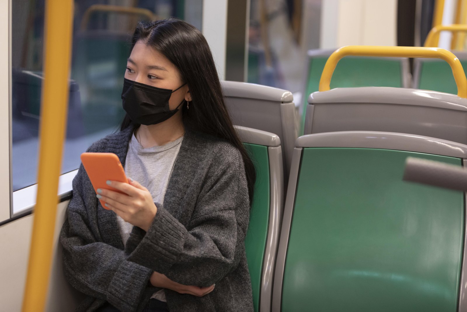 young-woman-with-mask-bus